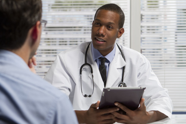 Doctor visiting with patient