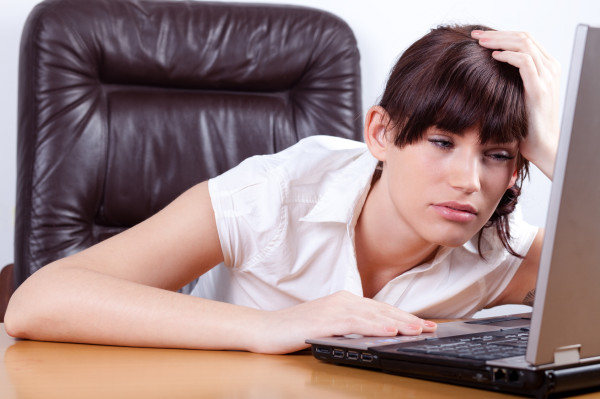 tired woman at computer